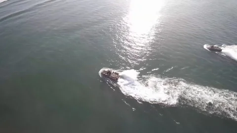 View from a drone of US Army amphibious assault vehicles navigating Stock Footage 93743494