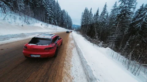 View from drone. Vehicles driving on snowy road. Local landscapes in winter Stock Footage 189377902