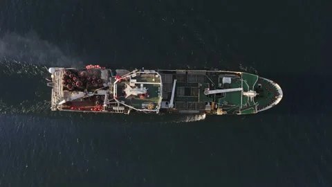 View from the drone vertically down on a fishing trawler at sea on the move Stock Footage 164611154