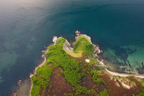 View from a drone vertically down on the rocks of Cape Kuzmin Foto stock