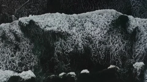 View from drone of volcanic black sand beach Stock Footage 231382288