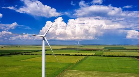 View from Drone at windpark and windmill farm. Wind turbine from aerial view. Stock Photos