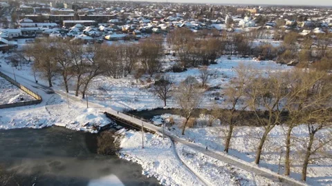 View from the drone. Winter. River. Village. Bridge over river. Видео 149367015