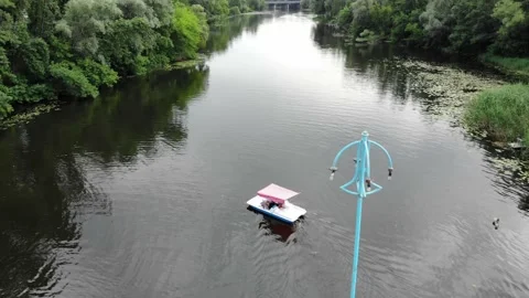 View from a drone young people float on a catamaran on the river Stock Footage 156206646