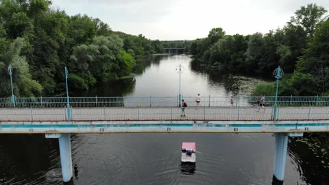 View from a drone young people float on a catamaran on the river Stock Footage 156206647