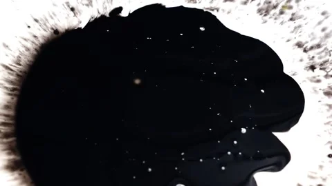 View of dropping black ink on a white paper Stock Footage 147701532