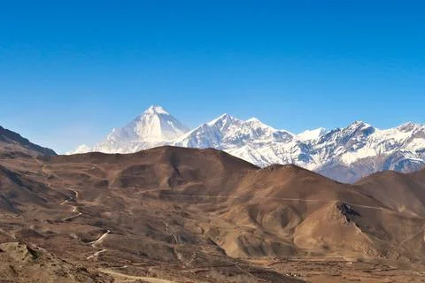 View onto the dry, hilly landscape that surrounds the town of Muktinath in .. Stock Photos