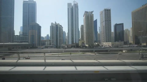 A view of Dubai city centre shot from inside a moving train. Stock Footage 311536880