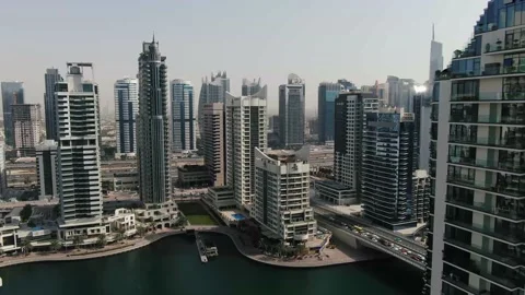View on Dubai Creek surrounded by massive skyscrapers, business and luxury, 4k Stock Footage 152885898