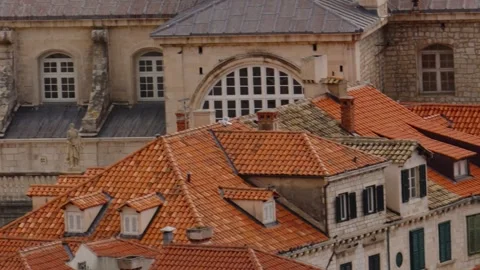 View of Dubrovnik rooftops with seagulls flying overhead in the historic old Stock Footage 313731335