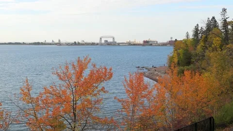 View of Duluth Lift Bridge, ship canal, Lake Superior shore, autumn leaves. Stock Footage 148582650