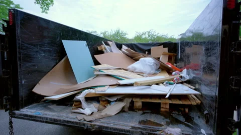 View of Dumpster full of garbage from construction site. Loaded truck view from Stock Footage 311906788