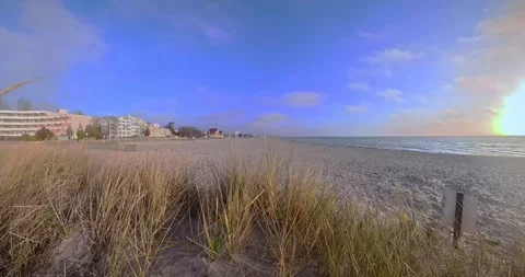 View from dune over winter beach in Groemitz on sunny day Video stock 334726661