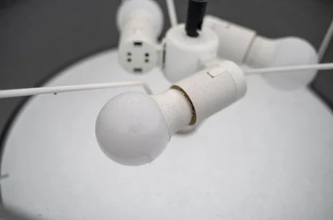 View of dusty light bulbs inside ceiling fixture Stock Photos