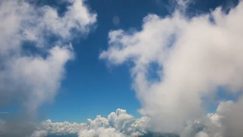 View of the earth and clouds from the window of the airplane. Stock Footage