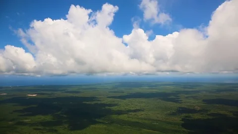 View of the earth and clouds from the window of the airplane. Stock Footage 81101134