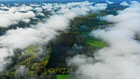 A view of the earth through the clouds. Ethereal Sky Journeys, Tranquility in Stock Footage 257770319