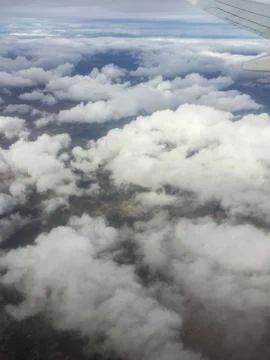 View of the earth from the window of an airplane with the wing Stock-Fotos