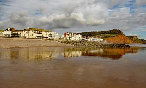 View of the eastern end of Sidmouth Esplanade and sandstone cliff. This cliff 스톡 사진