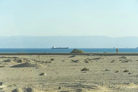 View of eastern side of the Suez Canal with picturesque desert sand dunes. Stock Photos