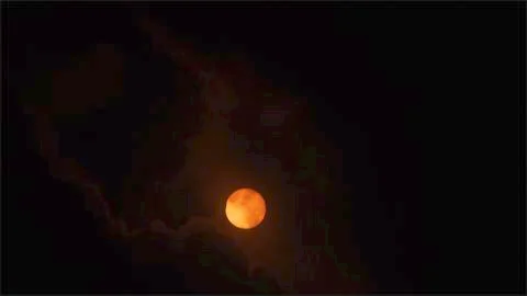 View of Eclipse through the Clouds. Stock Photos