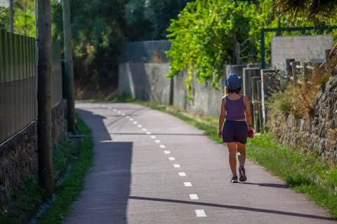 View of eco pedestrian / cycle path, with woman walking Stock Photos