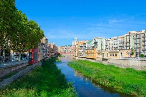 View of Eiffel Bridge over River Onyar, Cathedral and buildings of Girona, Spain Stock Photos