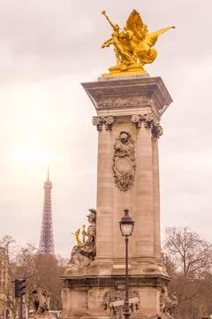 View of the Eiffel Tower and the Alexandre III bridge in Paris, France Stock Photos
