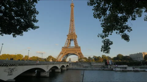 View of the eiffel tower and a bridge over the river seine, paris Stock Footage 58782325