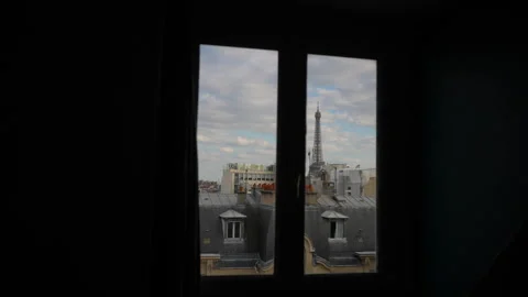 View of Eiffel Tower from apartment window on cloudy day. Tracking shot of Video stock 241597387