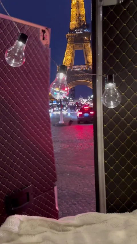 View of the Eiffel Tower from a campervan Stock Footage 230996694
