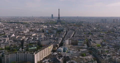 View of the Eiffel Tower in the center of Paris at sunset. A drone flies over a Stock-Footage 228773581