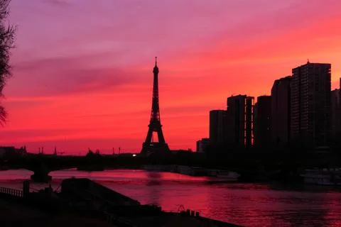 View on the Eiffel tower with group of modern buildings. Stock Photos