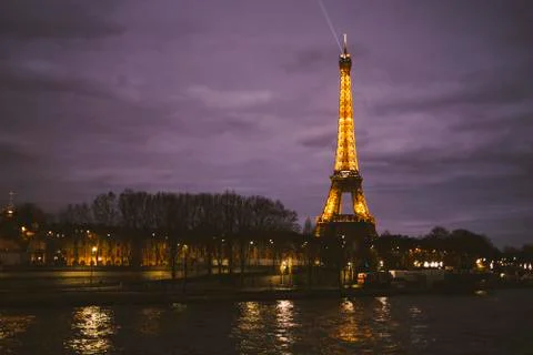 View of the Eiffel Tower at Night - River Seine with Trees Stock Photos