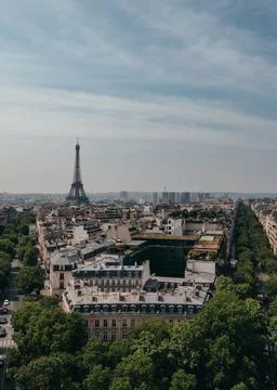 View of Eiffel Tower over rooftops of Paris from Arc de Triomphe. Fotos Stock
