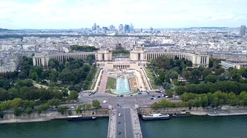 View from Eiffel Tower on Paris, cars passing, people walking on a bridge over Stock Footage 249880814