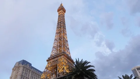 View of Eiffel Tower of Paris Hotel and Casino at dusk on The Strip, Las Vegas Stock Footage 99442994
