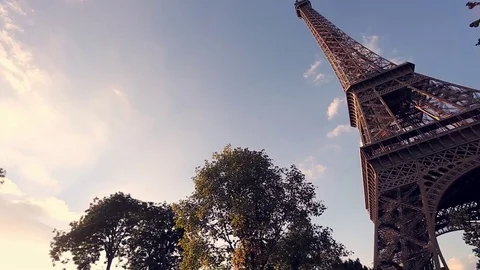 View of the Eiffel tower in Paris on a sunny summer day. Famous touristic places Stock Footage 73960891