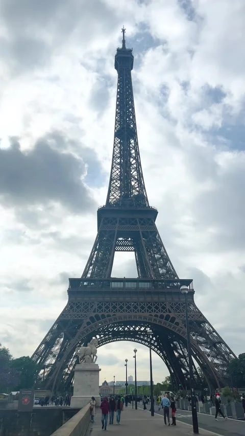 View of the Eiffel Tower from the Pont d'Iena bridge over the Seine River.  Video stock 311944196