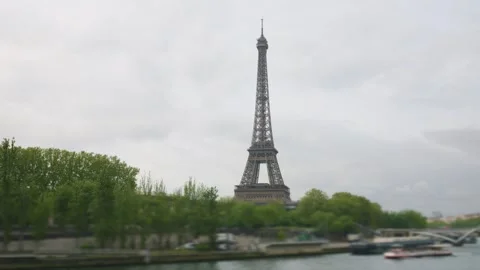 View of the Eiffel Tower from the right bank of the Seine River in spring.  Stock Footage 310832577