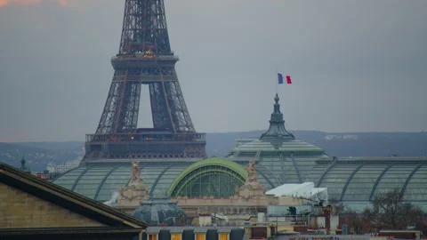 View of the Eiffel Tower from the roof of a Parisian old house. Sunset in paris Stock Footage 229475037