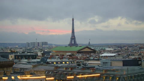 View of the Eiffel Tower from the roof of a Parisian old house. Sunset in paris Stock Footage 229475992