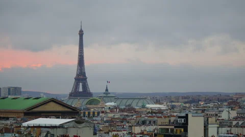 View of the Eiffel Tower from the roof of a Parisian old house. Sunset in paris Stock Footage 229626893