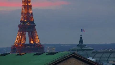 View of the Eiffel Tower from the roof of a Parisian old house. Sunset in paris Stock Footage 229950718