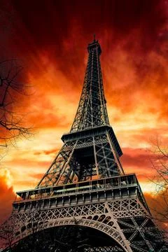 View of Eiffel Tower on sunset sky background Stock Photos