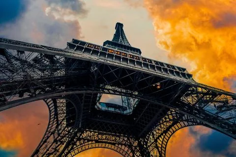 View of Eiffel Tower on sunset sky background Stock Photos