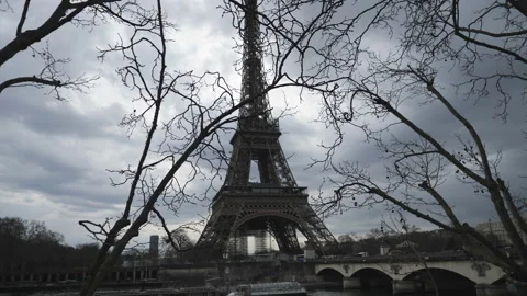 A view of the Eiffel Tower through branches of a tree in  the early spring. Stock Footage 171881998