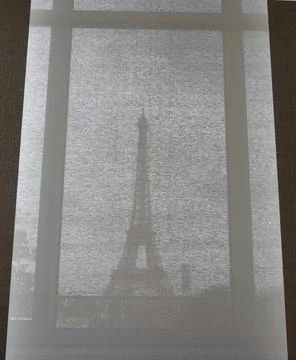 View on Eiffel tower through the curtains, Paris, France. Paris cityscape Stock Photos