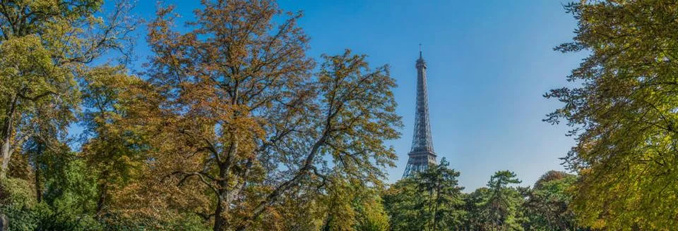 View of the Eiffel tower walking through Paris view of the Eiffel tower wa... Stock Photos