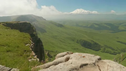 View of Elbrus from green plateau Bermamyth. Wild Russian nature Stock Footage 139718963